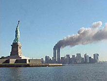9-11_National_Park_Service_Statue_of_Liberty_and_WTC_fire_sm.jpg
